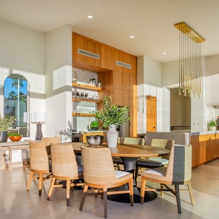 Your open-concept dining and kitchen space blends warm wood tones with modern elegance, creating the perfect setting for memorable meals together.