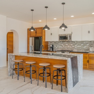 Fully equipped kitchen with bar seating -25