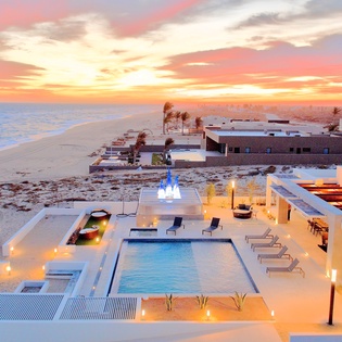 Patio during sunset with beachfront views