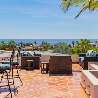 Rooftop with ocean views, outdoor seating and games