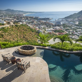 Sunny patio with ocean and city view