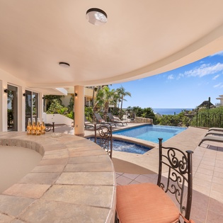 Patio with bar and lounge chairs