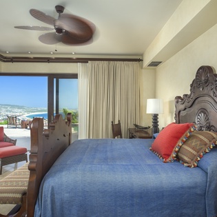 Bedroom suite with pocket door and ocean view