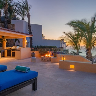 Lounge pool side with gorgeous ocean view during sunset
