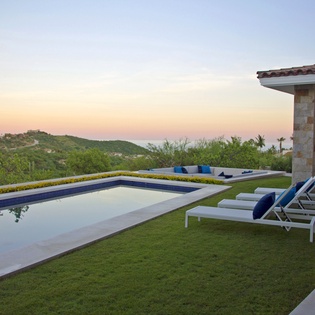 Pool with ocean view during sunset
