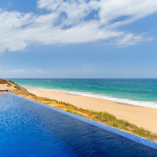 Infinity pool with breathtaking beach views