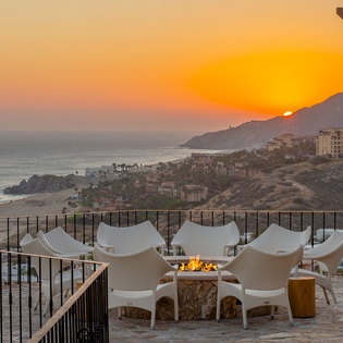 Your private terrace overlooks the coastline as golden sunsets paint the sky, creating magical evenings by the fire pit.