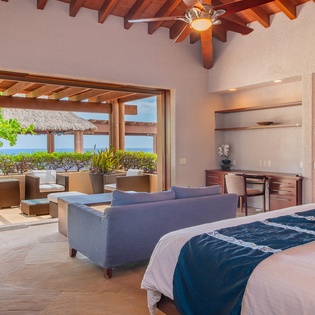 Bedroom suite with ocean view and outdoor seating
