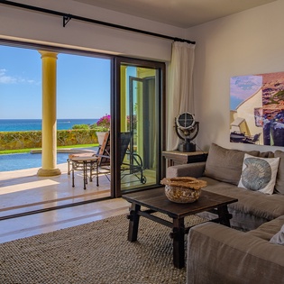 Family area with access to patio and ocean views
