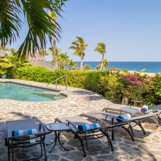 Lounge by the poolside with an oceanview