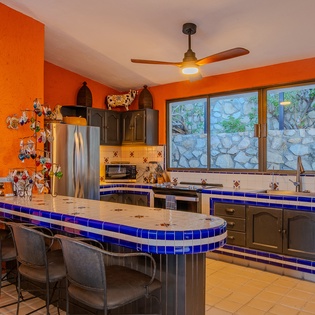 Fully equipped kitchen with bar seating