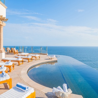 Sunny patio with infinity pool and incredible ocean views