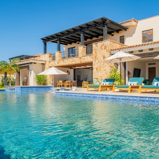 Stunning villa with pristine pool and elegant outdoor lounging areas for your perfect getaway retreat.