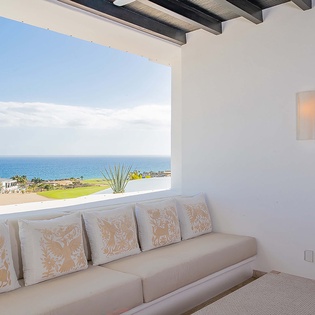 Settle into your covered terrace and soak in breathtaking ocean views that stretch to the horizon. The soft sea breeze and peaceful blue waters create your perfect escape.