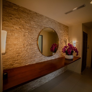 Your stylish entryway greets you with warm stone textures and elegant touches that set the perfect tone for relaxation.