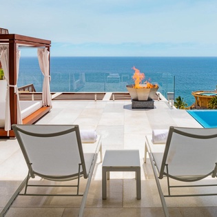 Patio with lounge chairs and outdoor bed
