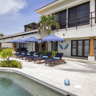 Poolside view with lounge chairs