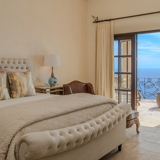 Bedroom suite with balcony access and incredible ocean views
