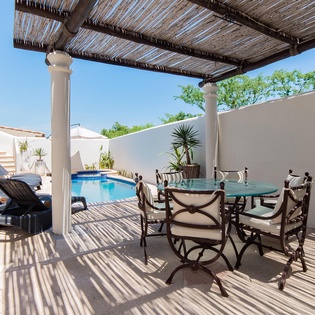 Inviting outdoor terrace with swimming pool, jacuzzi and patio furniture