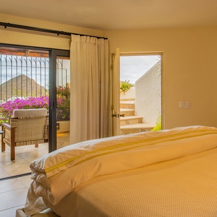 Bedroom suite with ocean view and terrace access
