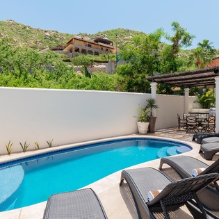 Inviting outdoor terrace with swimming pool, jacuzzi and patio furniture