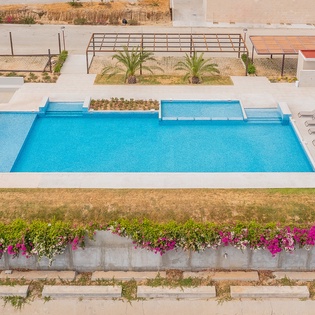 View of the infinity pool with jacuzzi accessible to all guests in the development