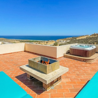 Rooftop terrace with hot tub and fire pit