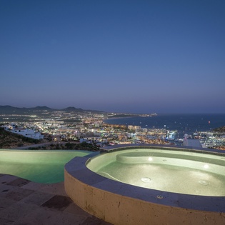 Infinity pool with city and ocean view