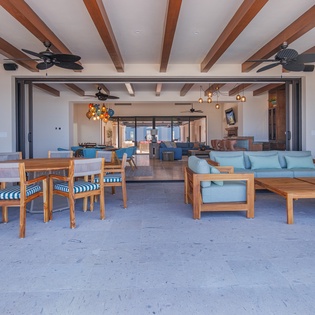 Outdoor seating and dining looking into living area