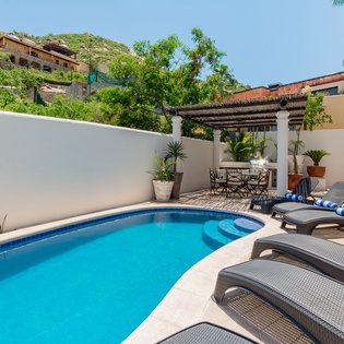 Inviting outdoor terrace with swimming pool, jacuzzi and patio furniture