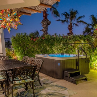 Terrace with outdoor seating and jacuzzi