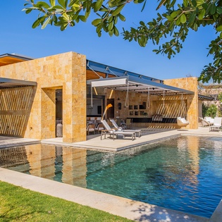 Poolside with view of villa