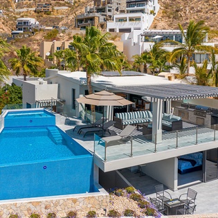 Modern hillside villa with stunning architecture, private pool, and mountain views in an exclusive coastal community.