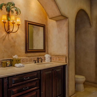 Indulge in your private spa-like bathroom with warm lighting, handcrafted tiles, and a luxurious walk-in shower.
