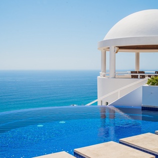 Outdoor patio with infinity pool and ocean view