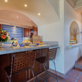 Bar seating by the kitchen