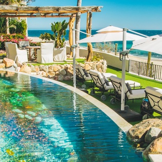 Poolside with beachfront views