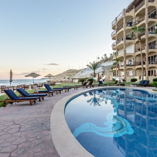Poolside with ocean views during sunset