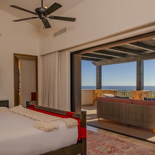 Wake up to breathtaking ocean views from your luxurious bedroom, where seamless indoor-outdoor living opens to your private terrace.
