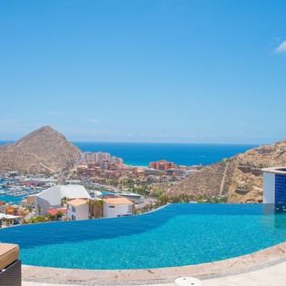 Infinity edge pool leads eye to marina view