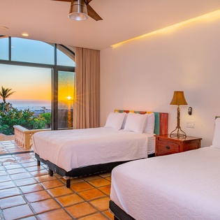Bedroom suite with 2 queen beds and incredible ocean views and outdoor access