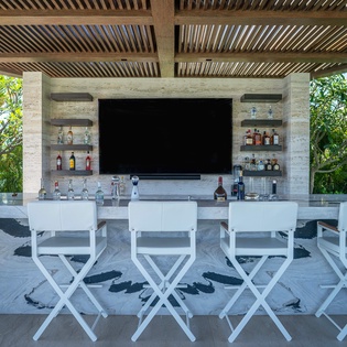 Patio with outdoor seating and bar