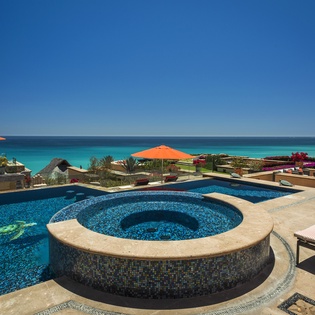 Dive into luxury with your private infinity pool and hot tub, where turquoise waters blend seamlessly with the ocean horizon.