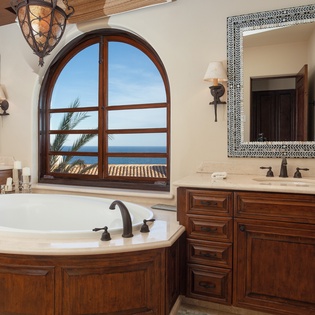En suite bathroom with bathtub and ocean views