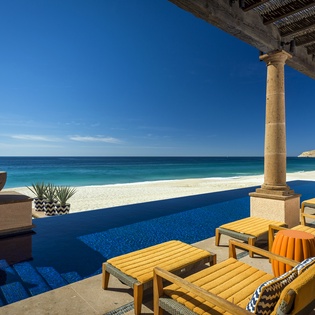 Unwind on your private infinity terrace where azure waters meet pristine sand, creating your perfect beachfront escape.