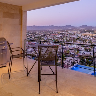 Terrace with city and ocean view at night-10