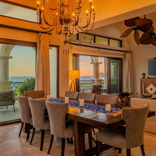 Dining area with access to balcony and ocean views