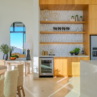 Your gourmet kitchen features warm wood cabinetry, marble countertops, and top-tier appliances for memorable culinary experiences.