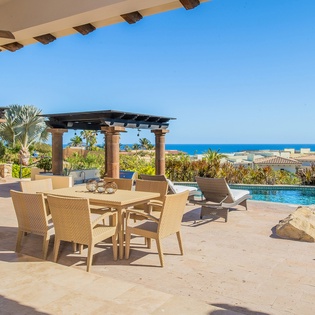 Outdoor terrace patio dining area and pool with views