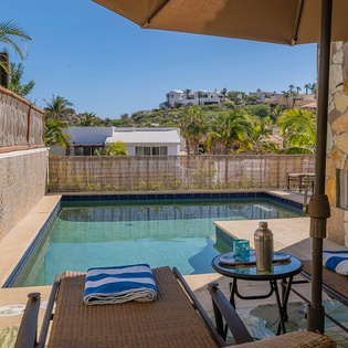 Lounge chairs with poolside view